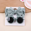 Detail view of sage green ribbed bow headband and bear ear sunglasses on display card - Bow Headband And Bear Sunglasses / Bean Green