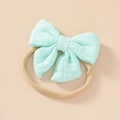Soft cotton baby headband with mint green bow on a stretchable nude nylon band - Emerald Green