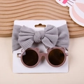 Grey striped bow headband and brown bear ear sunglasses set on white display card - Bow Headband And Bear Sunglasses / Gray