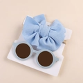 Detail view of light blue waffle bow headband and matching round kids sunglasses set - Card Packaged Set / Light Blue 2-Piece Set