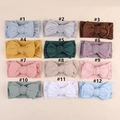 Detailed grid view of 12 assorted soft milk silk oversized bow headbands for infants - Random Color