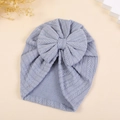 Detailed close-up of wheat-patterned knit light blue baby turban hat with a large bow - M / Slate Grey