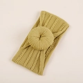 Vue détaillée du bandeau bébé jaune moutarde avec nœud beignet en jacquard et texture côtelée - Emballage OPP individuel / Jaune Gingembre (#12)