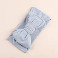 Close-up of light blue baby headband featuring a soft knit fabric with a large bow detail - Slate Grey