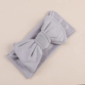 Detailed view of light grey infant headband with a large decorative double bow - Light Gray