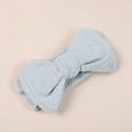 Detail of light mint green knitted bow headband with delicate hollow diamond patterns - 15.5x8.5cm / Grey Blue