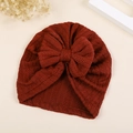 Dettaglio del cappello a turbante per neonato bordeaux con grande fiocco e maglia a lisca - M / Arancione Scuro