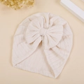 Dettaglio del fiocco in rilievo a spiga di grano sul turbante beige per neonati - M / Bianco Sporco