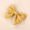 Handmade mustard yellow linen bow hair clip for girls with rustic fabric texture finish - 8*6.5 cm / Yellow