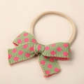 Detail of baby headband with green floral knit bow on a soft elastic skin-tone band - 9x6cm / Light Green Rose Floral