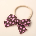 Detailed close-up of a pink baby nylon headband featuring a brown knit floral bow accent - 9x6cm / Dark Coffee Peach Floral