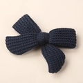 Detailed close-up of navy blue knitted bow hair clip featuring waffle texture and cotton yarn - 9*6CM / Black