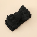Détail de la texture du bandeau bébé noir avec grand nœud en tissu gaufré élastique - Noir