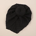 Detailed top view of black ribbed knit baby turban featuring a classic donut knot design - Black
