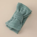 Detail of sage green knitted baby headband featuring a large textured bow design - 17*8cm / Bean Green