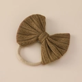 Detailed close-up of a caramel jacquard bow headband with soft nylon elastic texture - 11x9cm / Khaki