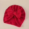 Detalle de turbante para bebé en punto acanalado rojo con un gran lazo y textura suave - Rojo Oscuro