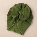 Close-up detail of grass green knit baby turban hat with a large decorative bow - One Size / Army Green