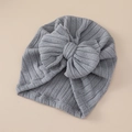 Detailed view of grey ribbed knit baby turban hat with a large decorative bow - Dark Gray