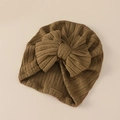Detail of baby turban hat with olive green ribbed knit fabric and large bow design - Khaki