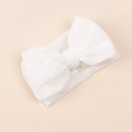 Close-up of white mesh baby headband with a large lace bow on a soft pink background - White