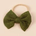 Close-up of baby nylon headband featuring a dark green mesh fabric bow with raw edges - Olive Green