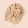Detailed view of beige soft knit baby hat with layered bow and pleated texture - Nude