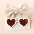 Detail of baby set with beige waffle knit bow headband and white heart-shaped sunglasses - Off White