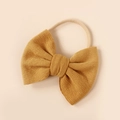 Macro view of mustard yellow knit bow texture on super soft nylon baby headband - Mustard Yellow (#6)