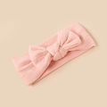Detailed view of pink ribbed knit baby headband with a soft oversized bow design - Pink Style (#7)