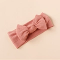 Detail showing pink ribbed knit texture and soft elastic bow headband for infants - Dusty Pink Style (#8)