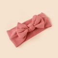 Close-up of pink ribbed fabric baby headband with a large decorative bow - Light Pink Style (#9)