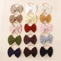 15-piece set of newborn baby headbands with soft textured fabric bows and nylon bands - Random Color