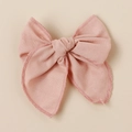 Detailed close-up showing the linen fabric texture and stitching of a light pink hair bow - Light Pink