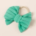 Close-up of mint green lace bow headband with elastic nylon band for babies and girls - 11x10cm / Turquoise Green