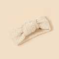 Detailansicht der weichen Lammwolltextur und des Knotendesigns auf dem Baby Stirnband - 19*8.5cm / Beige