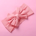 Close-up of baby headband with ribbed texture and large bow in soft pink fabric - Bow Ribbed Style / 17*9cm / Medium Pink