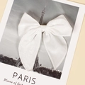 Detail of a large white velvet bow hair clip with long ribbons on a vintage card - 13cmx12.5cm / White