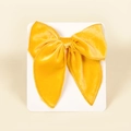 Detailed view of mango yellow velvet swallowtail bow hair clip on a display card - 13cmx12.5cm / Gold Yellow