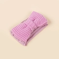 Close-up of baby knitted headband with bow design and soft thermal texture in pink - Purple