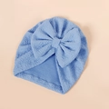 Detail of light blue baby turban hat with textured jacquard fabric and large bow - 17*18.5cm / Blue