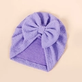 Detail of purple seersucker baby turban hat featuring a large soft bow decoration - 17*18.5cm / Purple