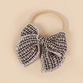 Détail du bandeau bébé en nylon souple avec un élégant nœud en tweed noir et blanc - 10.5*10.5cm / Noir & Blanc