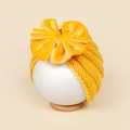 Cappello neonato giallo lavorato a maglia con grande fiocco in velluto e trama a coste - 18*14cm / Giallo