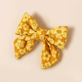 Dettaglio del fermaglio per capelli a fiocco jacquard giallo con trama di tessuto morbido - 7.7*7.1cm / Giallo Oro