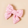 Dettaglio di un fermaglio per capelli a fiocco rosa con trama jacquard e stile dolce - 7.7*7.1cm / rosa pesca