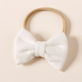 Detail of white faux cashmere bow on a nude nylon elastic headband for babies - 8.5*6cm / White