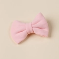 Detailed view of a soft pink faux cashmere bow hair clip for girls with a fuzzy texture - 8.5*6cm / Pink