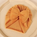 Détail macro du turban pour bébé en velours côtelé jaune avec grand nœud papillon - 17.5*8.3cm / Orange