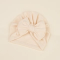 Close-up of soft beige baby turban hat featuring a large decorative cashmere-like bow - 17.5*18cm / Beige